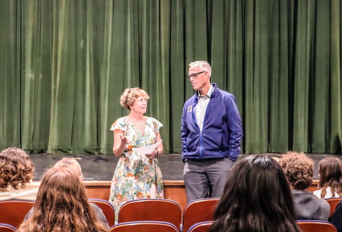 Raquel Nelson introduces U.S. Rep. Huffman to an audience of Archie Williams students. 