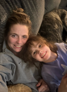 Coach Cat Catanzaro holds her daughter, Kate. The Forest Scout is profiling parents, teachers, and siblings in honor of Autism awareness month.