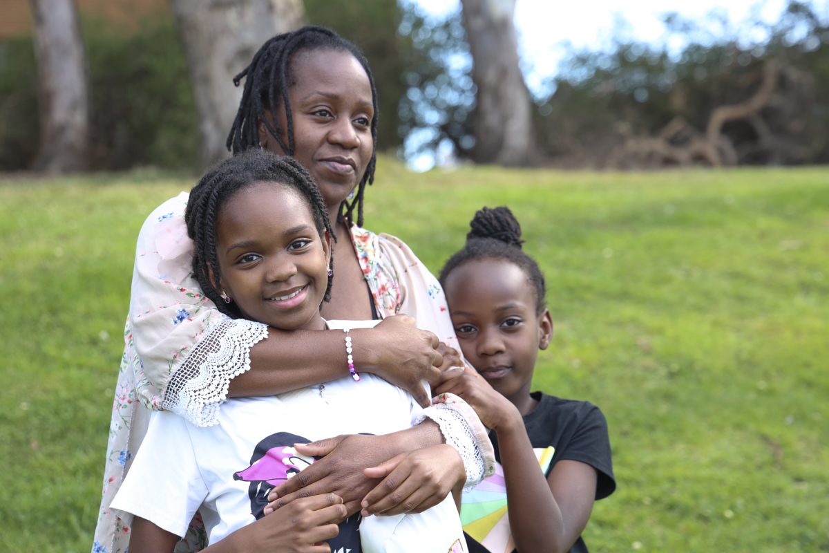 Francia Telesford stands with her two daughters, oldest and the youngest, after her in-person mommy wellness group at Charles. H Wilson Park in Torrance on Saturday, April 4, at 3 p.m. Telesford, 41, is the owner and founder of Gracelamp Wellness, a business started in hopes of increasing mental wellness in motherhood. The business was inspired by her own experience with post-partum.  (Chelsea Alvarez | Warrior Life)