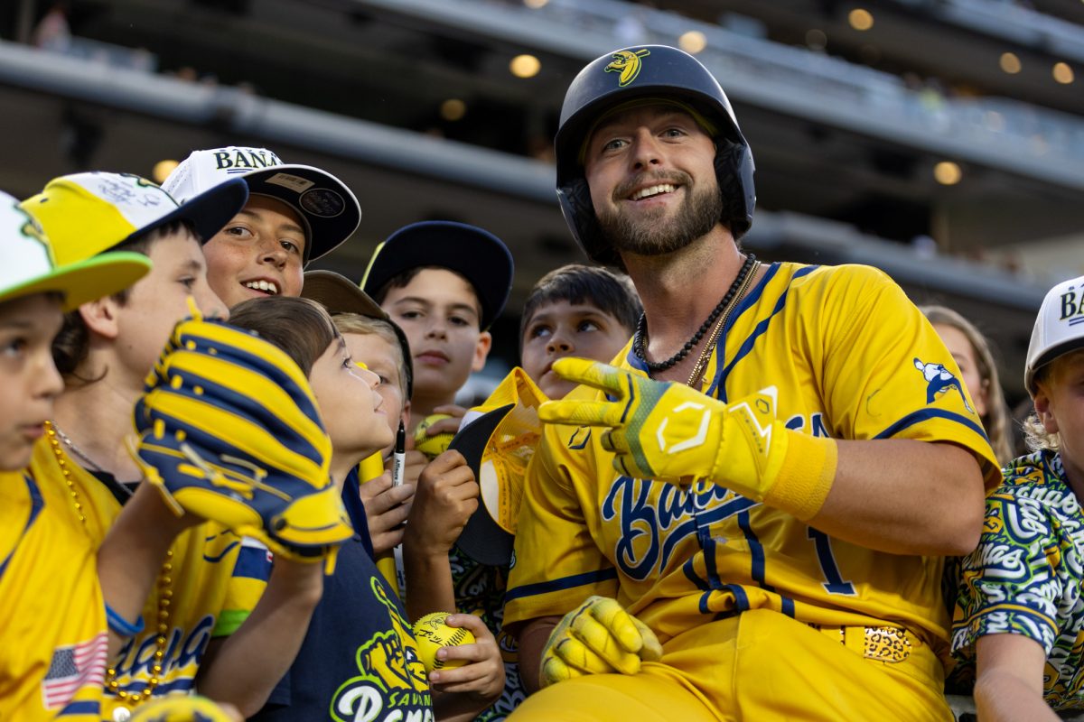 Catcher Bill Leroy (1) poses with fans during Savannah Bananas at the Texas Tailgaters at Kyle Field on Saturday, May 2, 2026. (Adriano Espinosa/The Battalion)