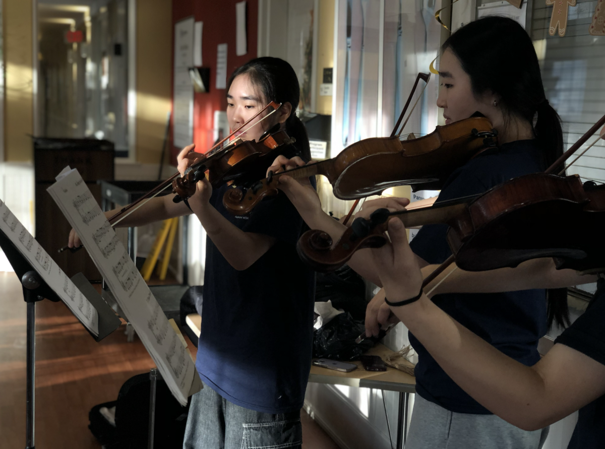 Harmony With U performs Christmas carols to shelter kids at Katherine Hanley Shelter. Moon organizes music lessons, concerts and other events to expand access to music.