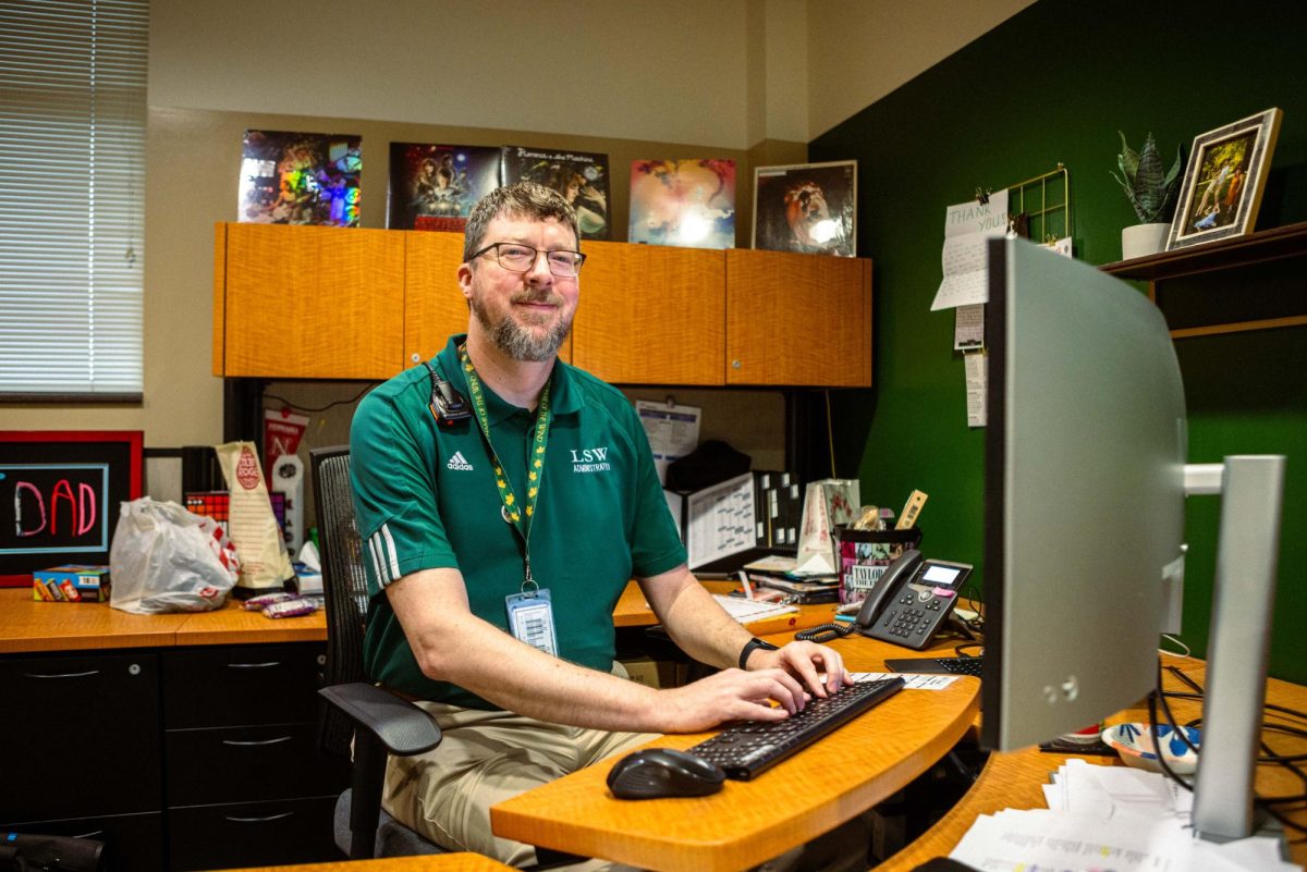 Mr. John Matzen sits at his desk as he begins another day as principal of LSW. This school year will mark his fifth year as principal.